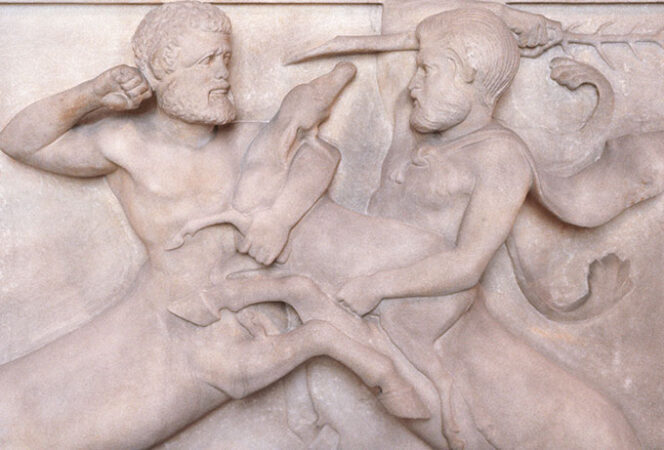 two centaurs fighting carveed into stone